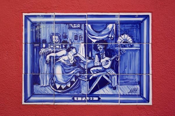 Tiles depicting a famous painting about Fado in Alfama