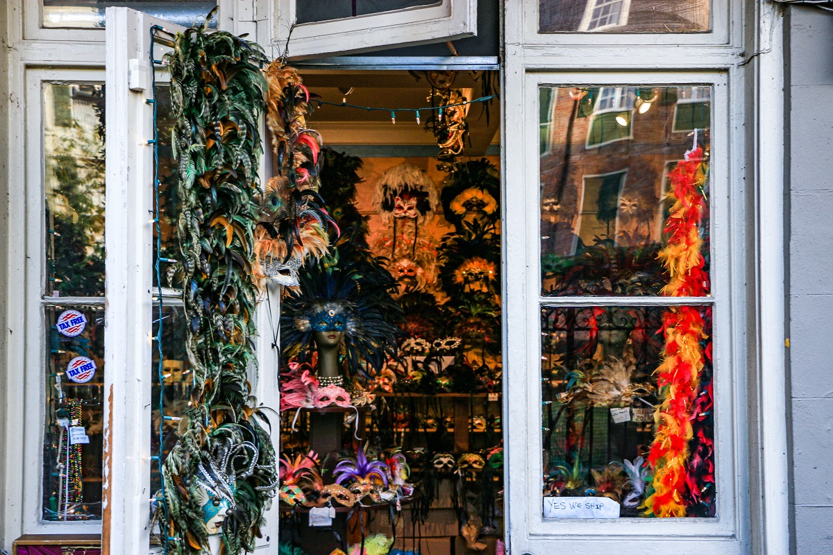 Store in New Orleans filled with colorful mardi gras face masks