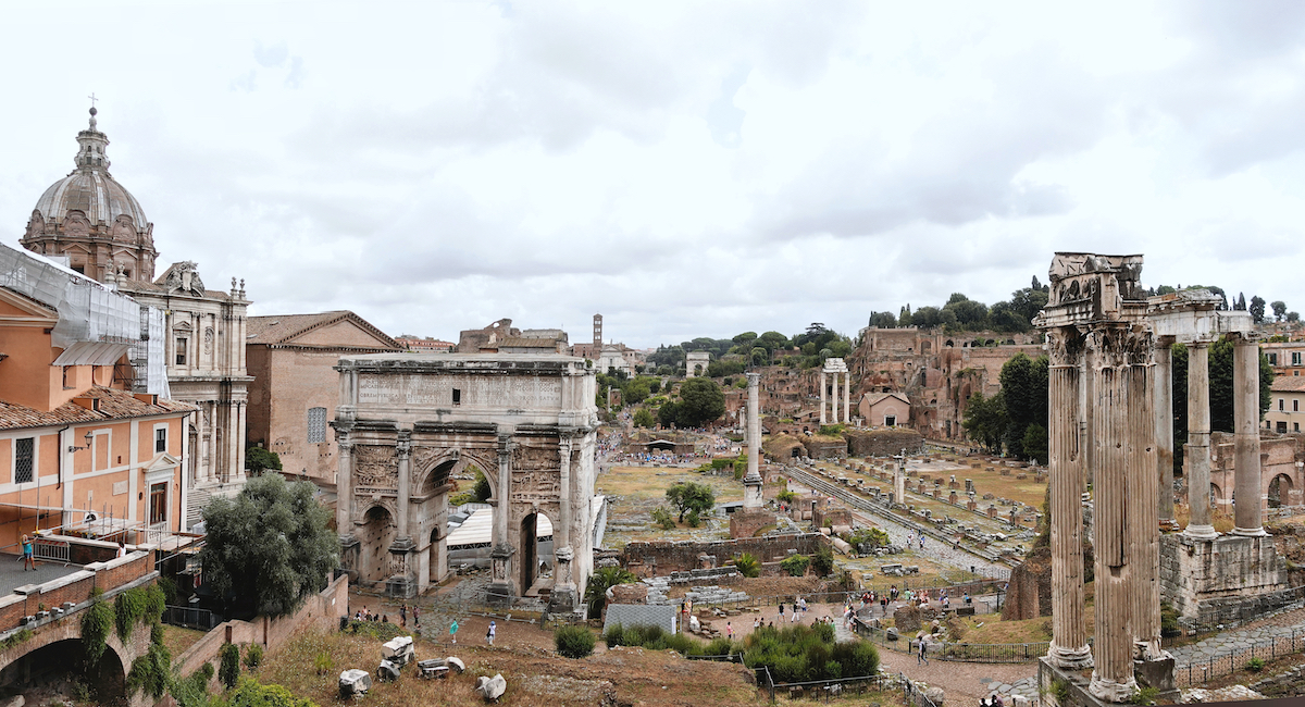 Ruins of ancient arches and pillars making up the Roman Forum in Rome, Italy.