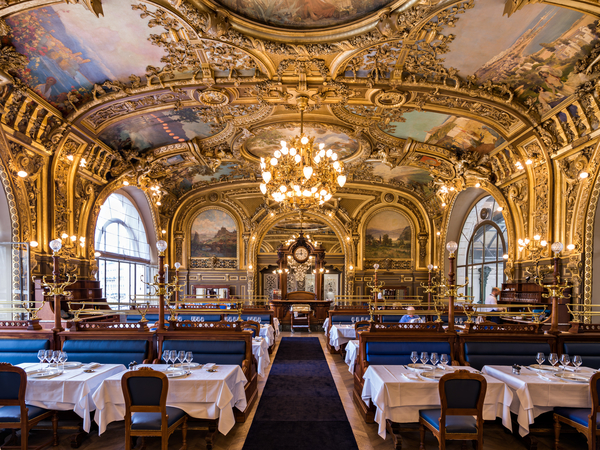 The ornate gold interior of Le Train Bleu, one of the most romantic restaurants in Paris.