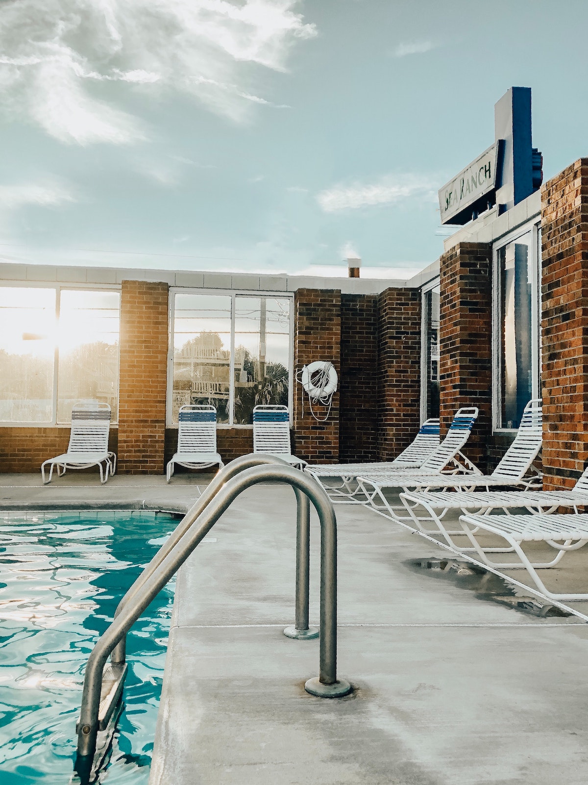 Poolside view with deck chairs