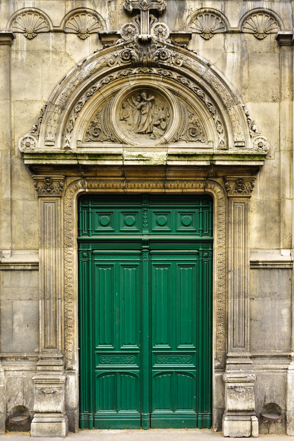 Intricate green door in Paris