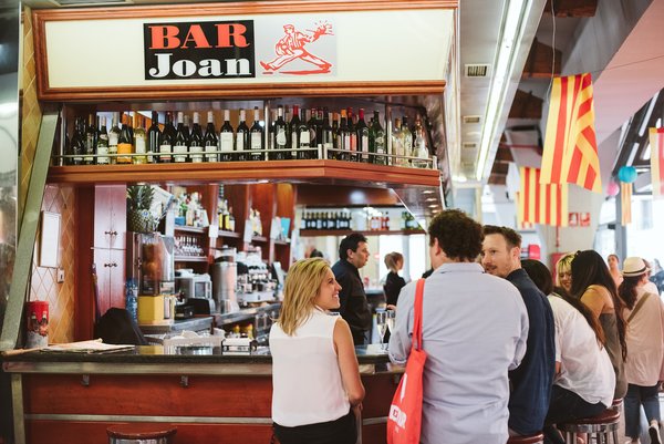Get over your fear of eating alone in Barcelona by eating at a market bar among the locals.