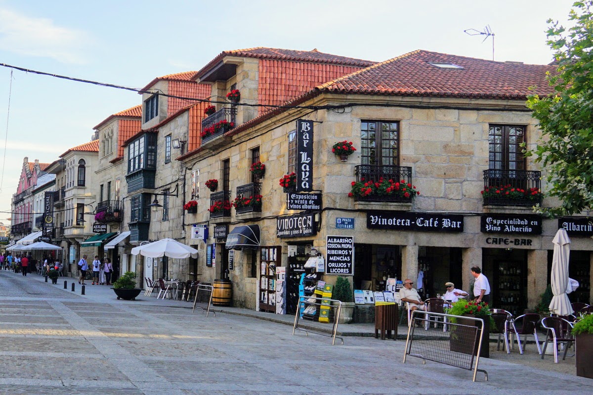 City street in Galicia, Spain with a small bar in the foreground