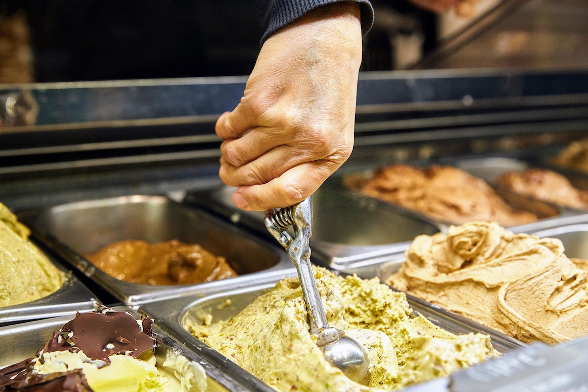 Close up of a person scooping gelato