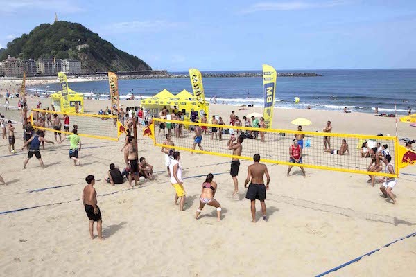 Sports and athletic events, like this beach volleyball tournament, is an important part of the festivities during Semana Grande in San Sebastian.