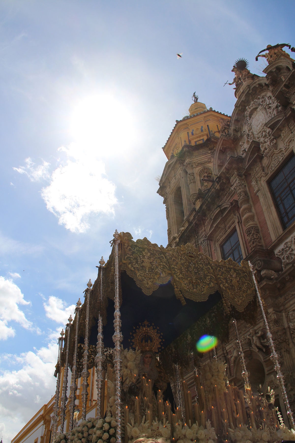 A daytime Easter procession in Seville during Semana Santa