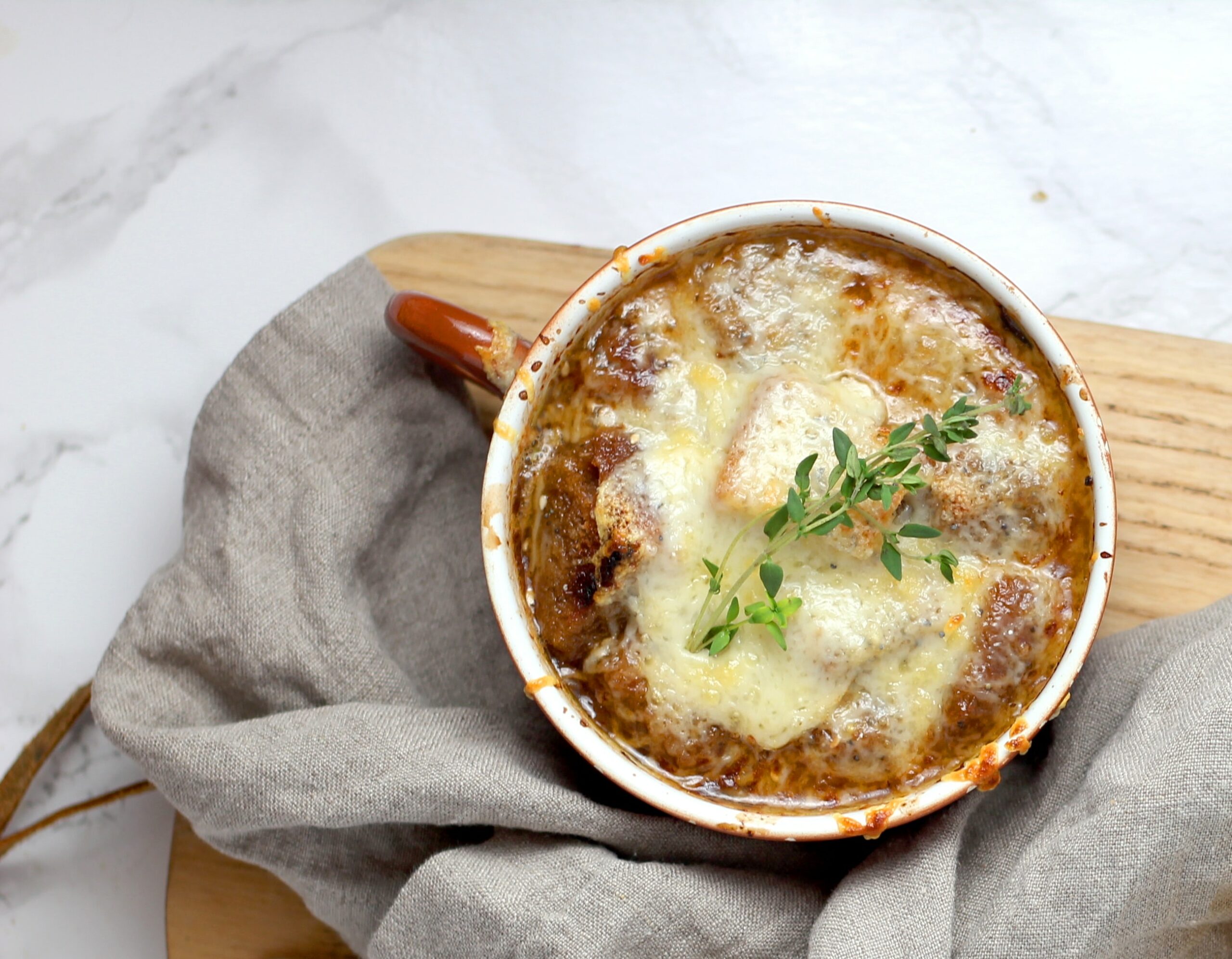 French Onion Soup on a wood board