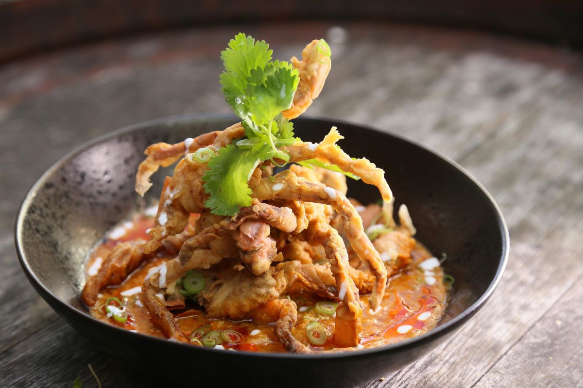 soft shell crab in brown bowl on wooden table
