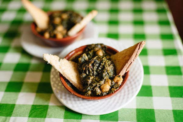 Tapas, like spinach and chickpeas, are perfect bites for eating alone in Seville.