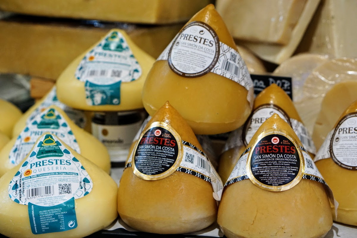Cone-shaped pieces of Galician cheese for sale at a market