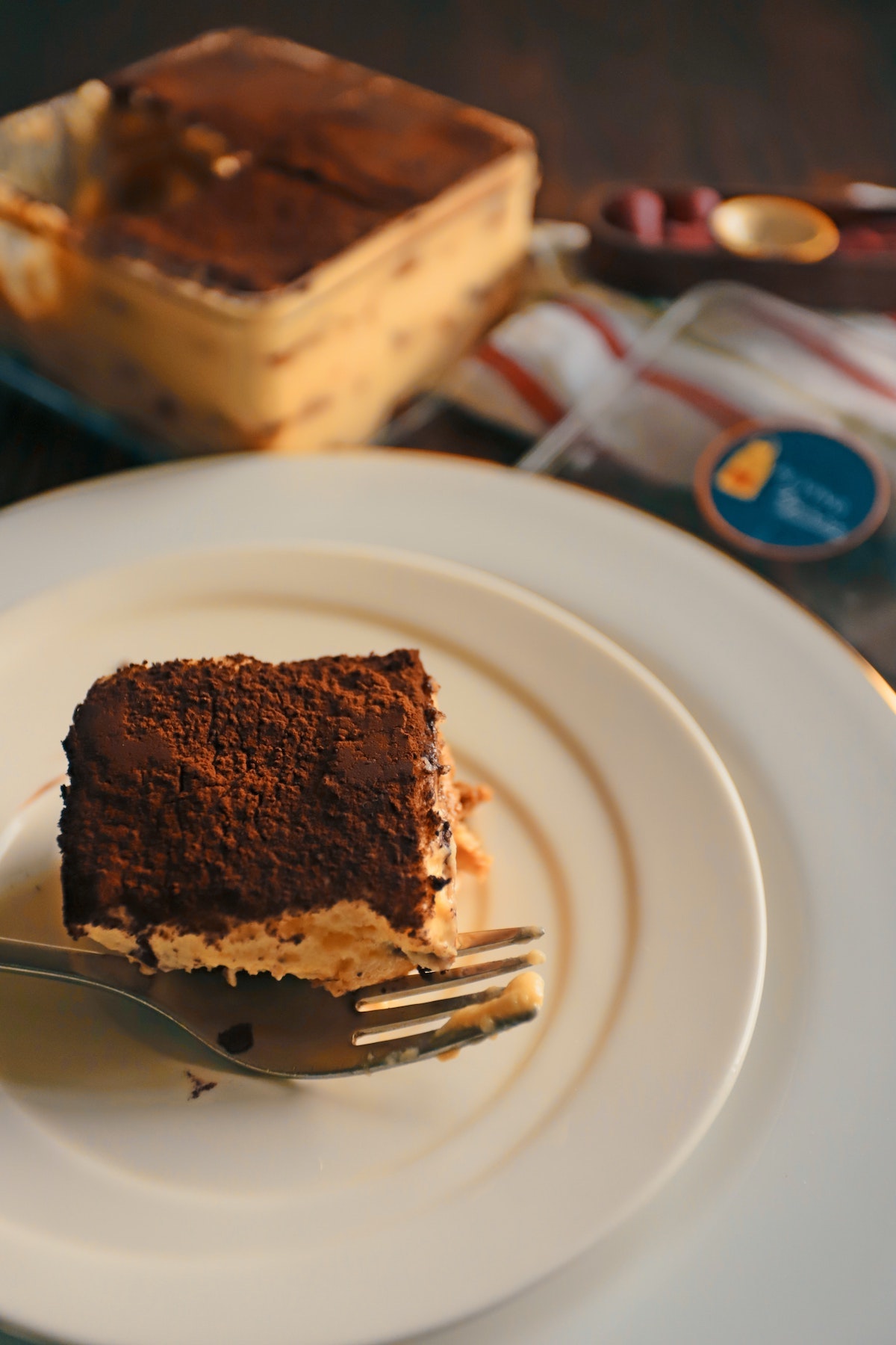 Slice of tiramisu on a white plate