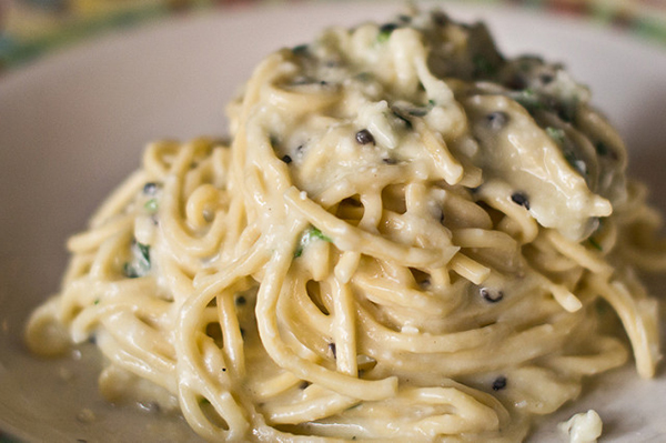 Black truffle cacio e pepe is one of the standout dishes at Taverna Fori Imperiali, one of the best restaurants in Monti, Rome.