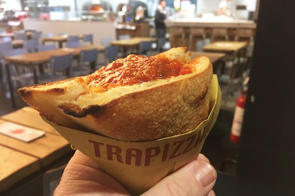 A trapizzino—a pizza dough pocket stuffed with meatballs—is one of the most popular options at food markets in Rome!