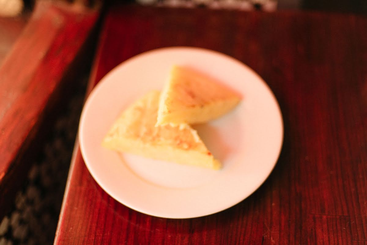 Two slices of Spanish omelet on a white plate