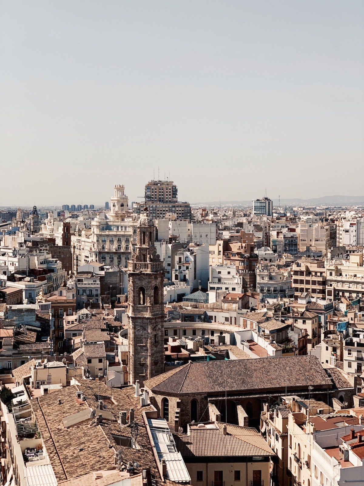View of downtown Valencia, Spain from above, with the cathedral tower in the foreground.
