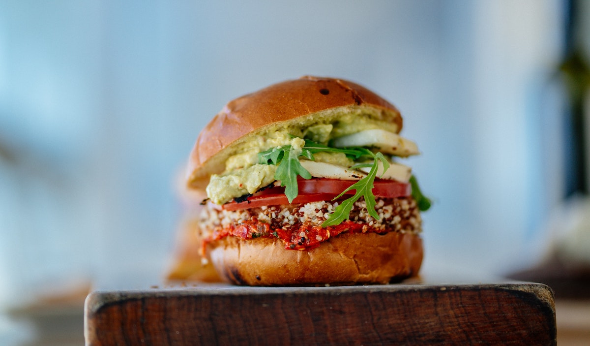 Vegan burger with guacamole and vegetables