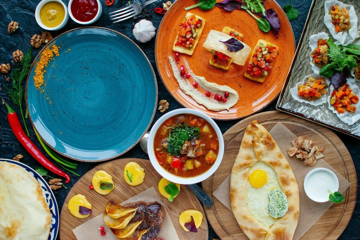 colorful plates with different Georgian foods in NYC