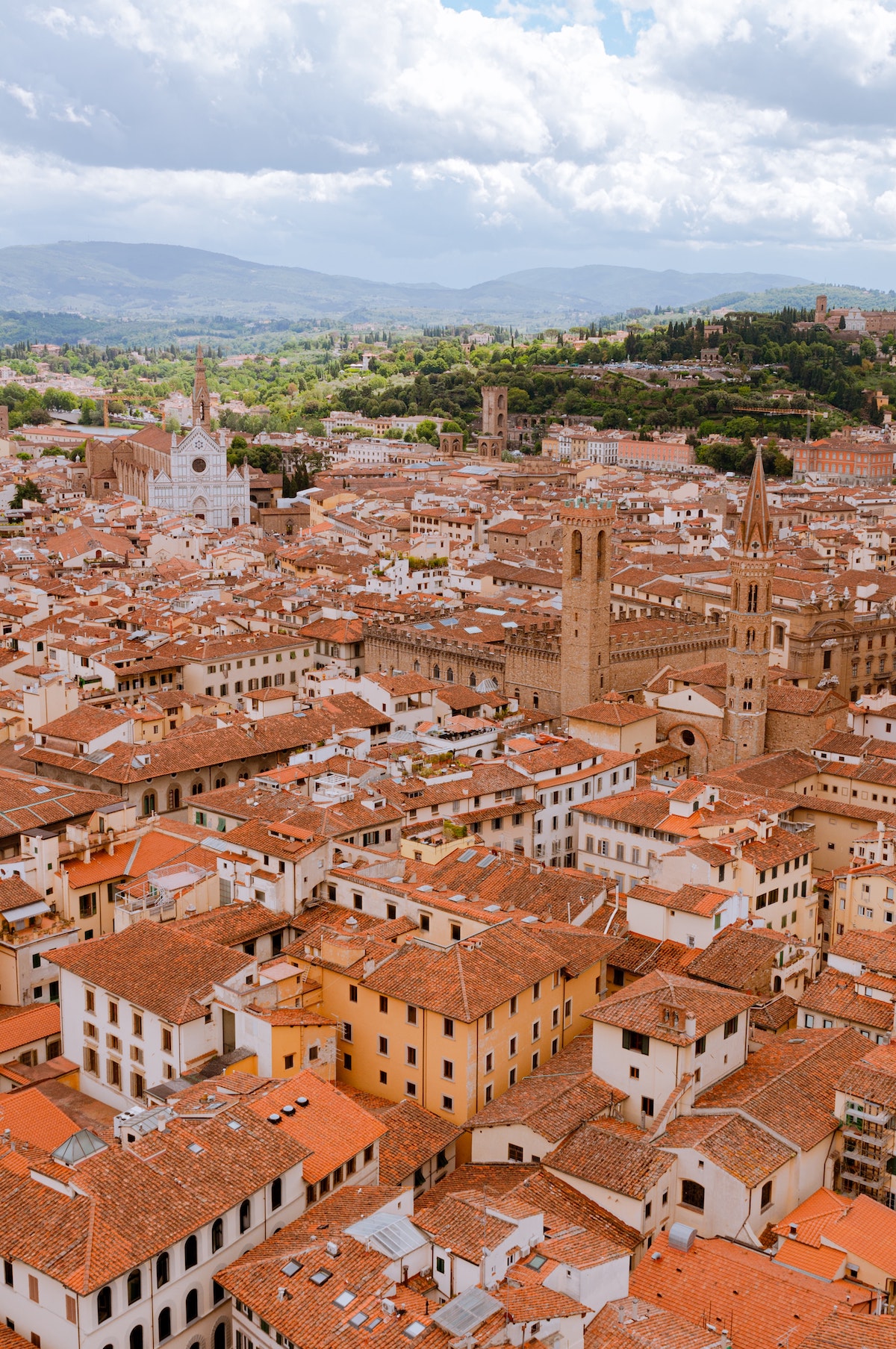 View over a historic town center with red-tiled roofs on many of the buildings