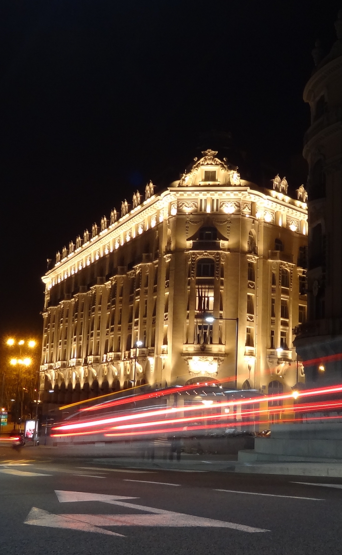 Exterior of the Westin Palace Hotel in Madrid illuminated at night.