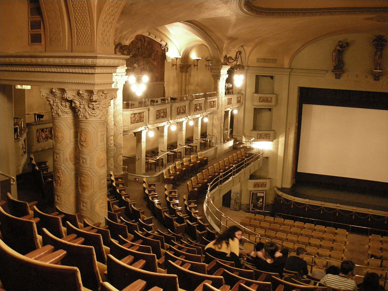 old theater hall with wooden chairs 